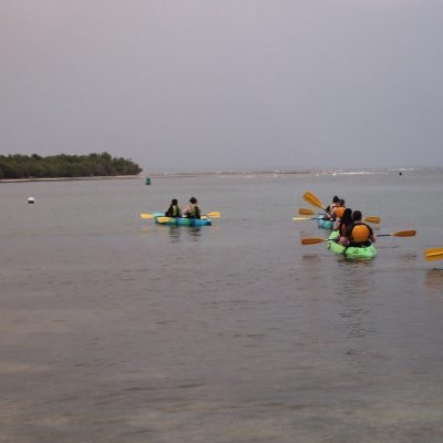 people in kayak in water